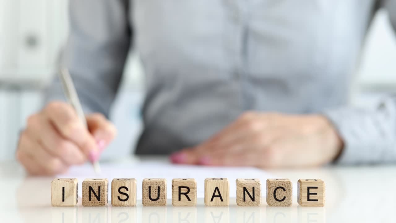 Person signing official insurance contract.