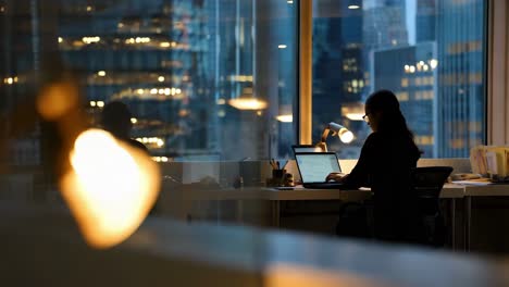 woman working late at a modern office