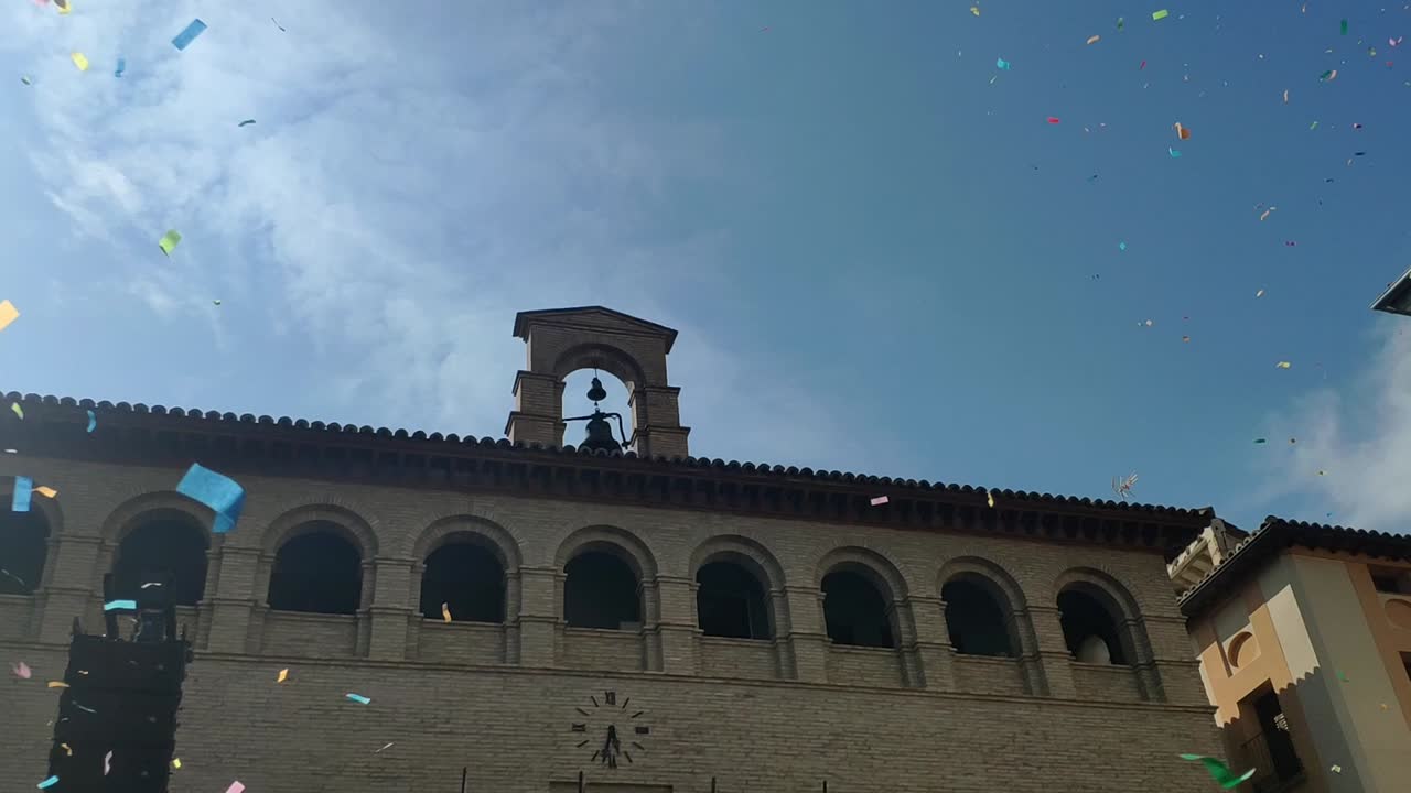 Celebratory confetti falls outside Borja Town Hall during the Amante Festival in Aragon
