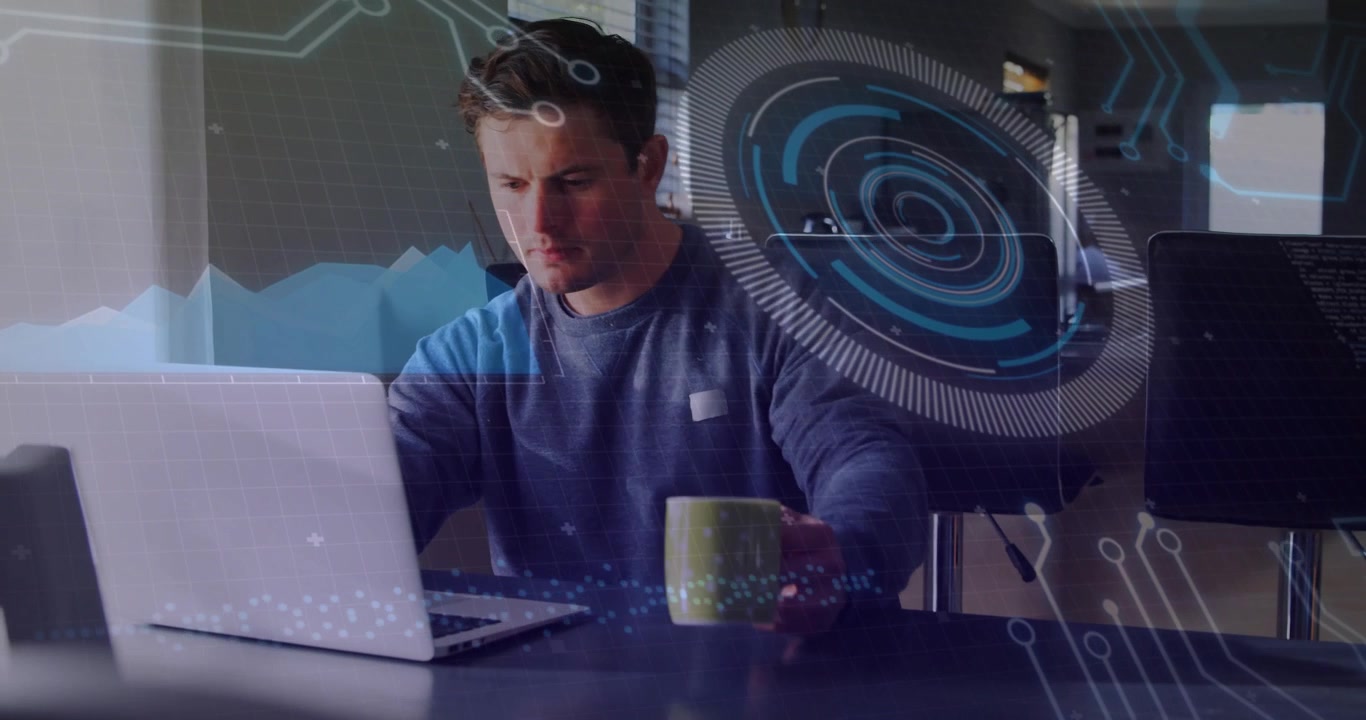 Man sipping coffee from green mug then typing on laptop analyzing data overlays for tech analysis