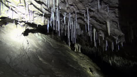 cave formations, soda straws, flowstone, ribbons, and columns in dark