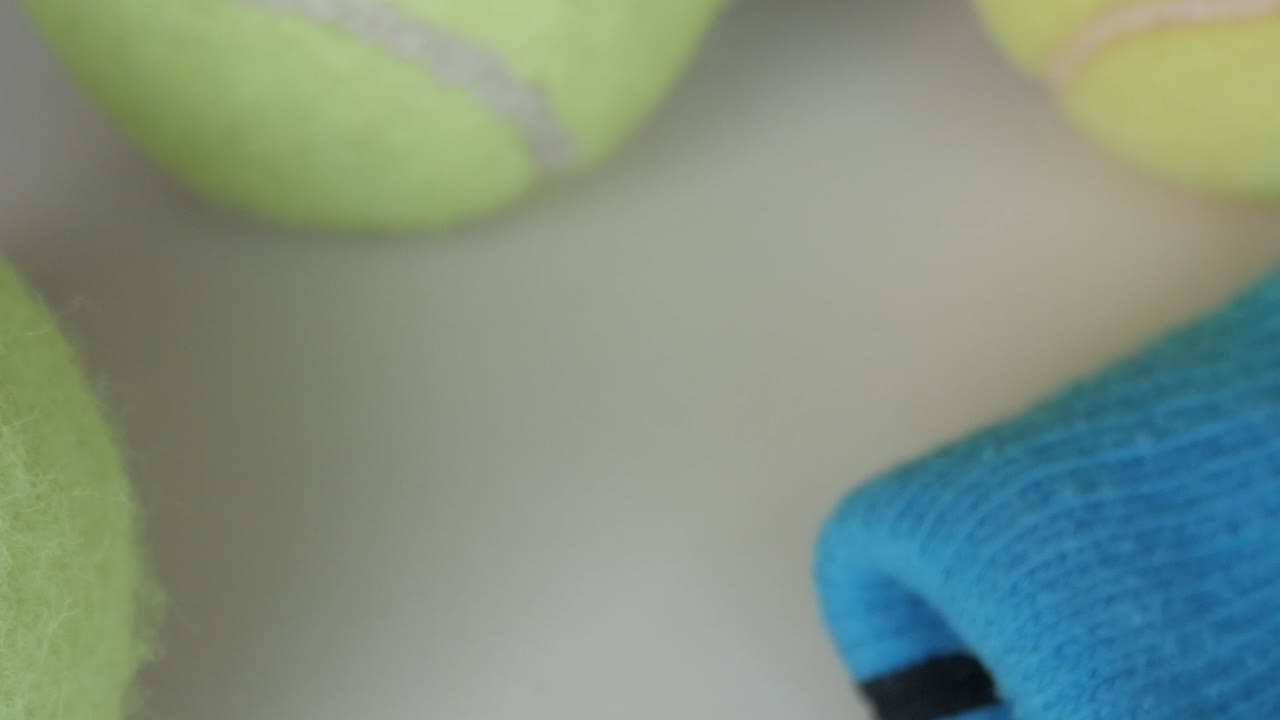 Close-up of tennis balls, bright and focused, feeling of play