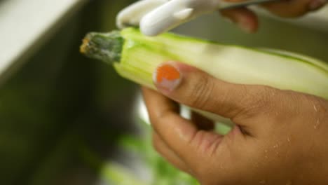 peeling a zucchini