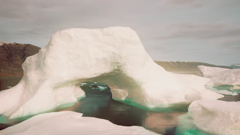 stunning iceberg with a hole in it