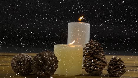 caída de nieve con decoración de velas de navidad