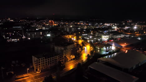 aerial view around traffic on the illuminated streets of turku, night in finland