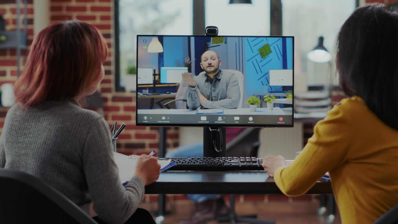 Team of people recruiting candidate on video call job interview
