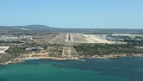 an approach to land as seen by the pilots ,shot from a jet cockpit at palma de malllorca airport