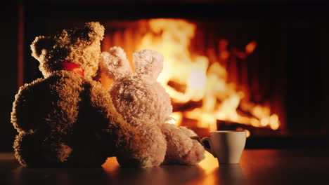 tea by the fireplace two friends bear and hare look at the fireplace next to a cup of tea