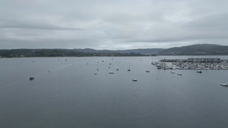 Aerial-View-Of-Sailboats-Near-Club-Náutico-Ría-de-Ares-Yacht-Club-In-Ares,-A-Coruña,-Spain