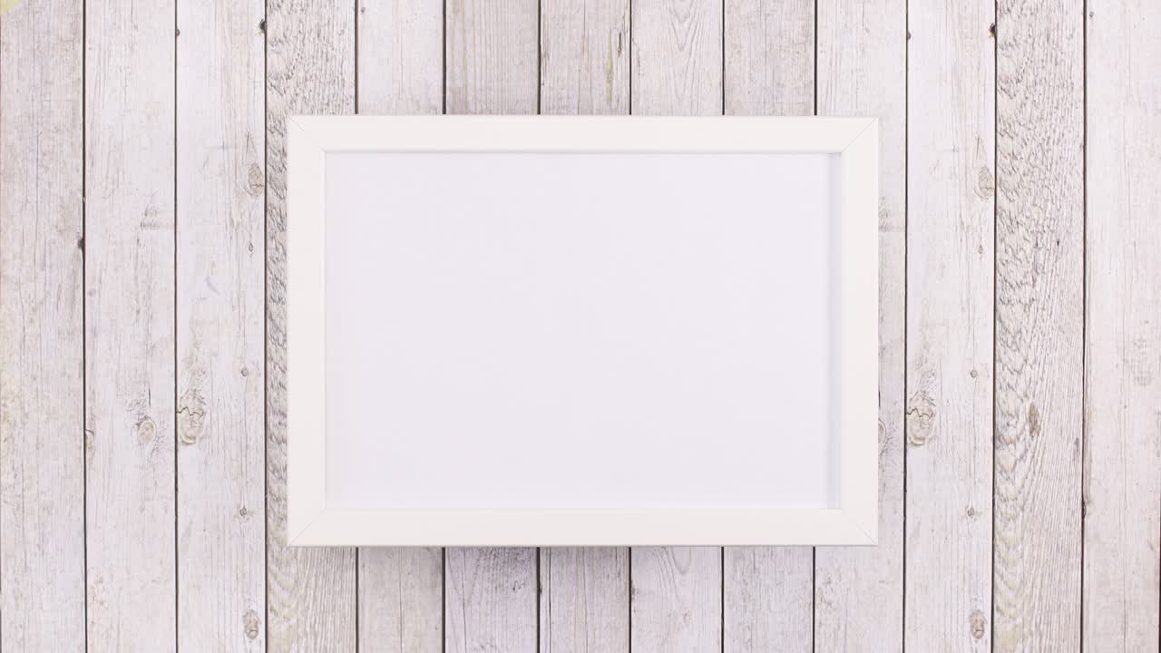 Gold and red Christmas ornaments appear around empty frame for text. Stop motion