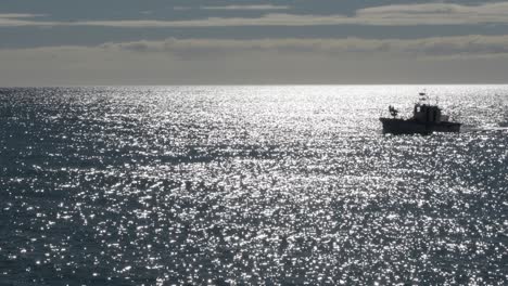 little fisher ship navigating to port a sunny morning