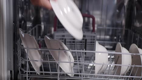 a close-up view of clean dishes in a dishwasher