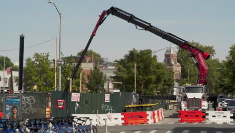 crane working on building foundation for highrise residential structure