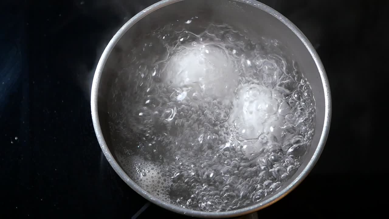 Eggs Boiling in a Pot of Hot Water