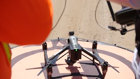 drone crew readying a drone for takeoff