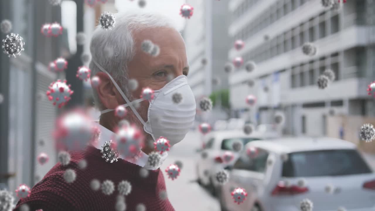Animation of covid 19 cells over senior man wearing face mask