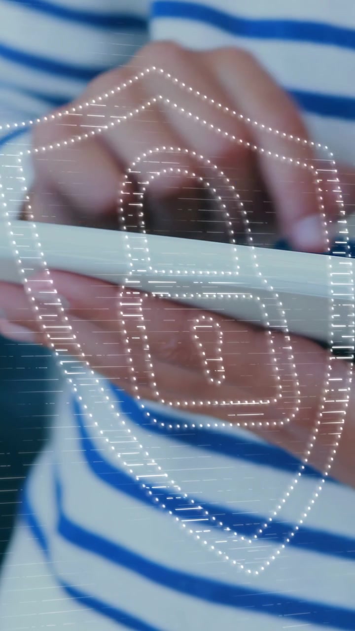Vertical video: Girl tapping tablet, activating dotted shield-lock overlay showing edtech security