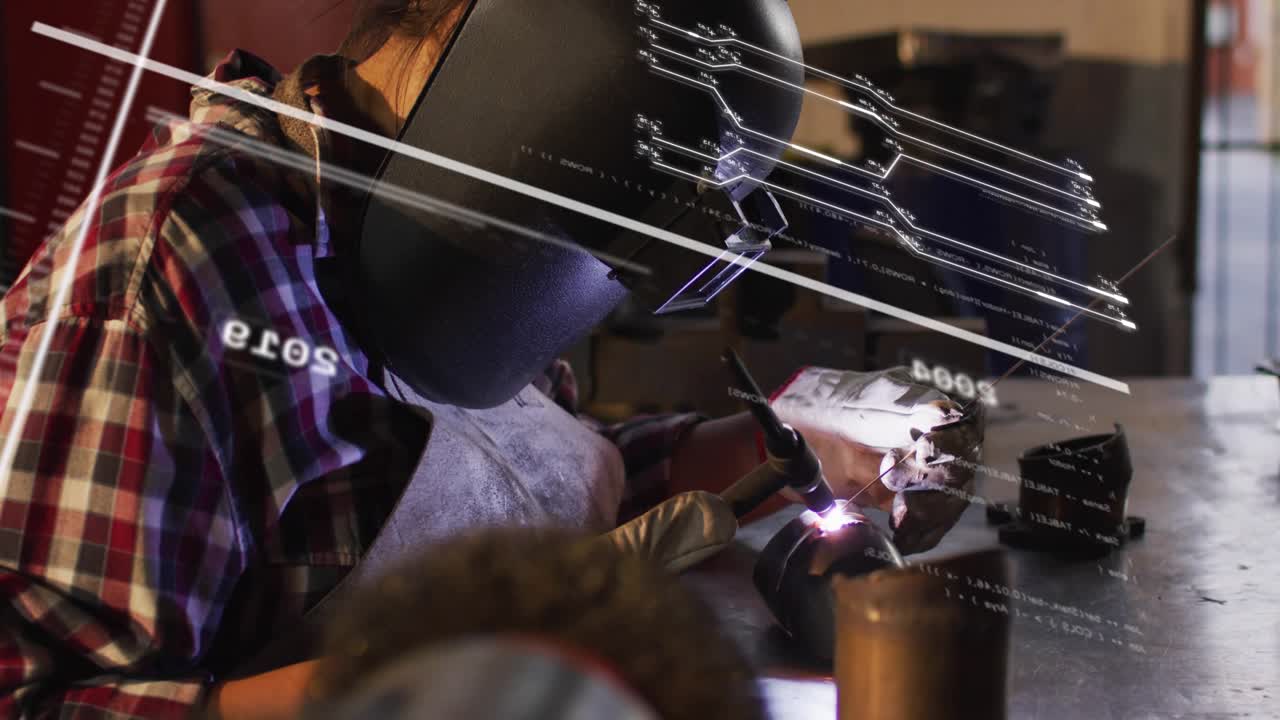 Woman welder producing arc in workshop, activating HUD while adjusting joint and completing weld