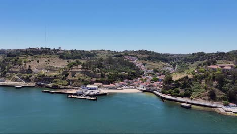 drone shot reversing out over the river from porto brandao in portugal