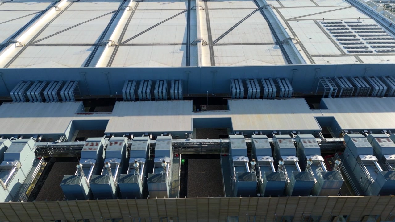 Drone view of critical cooling systems and industrial fans at a modern data center.