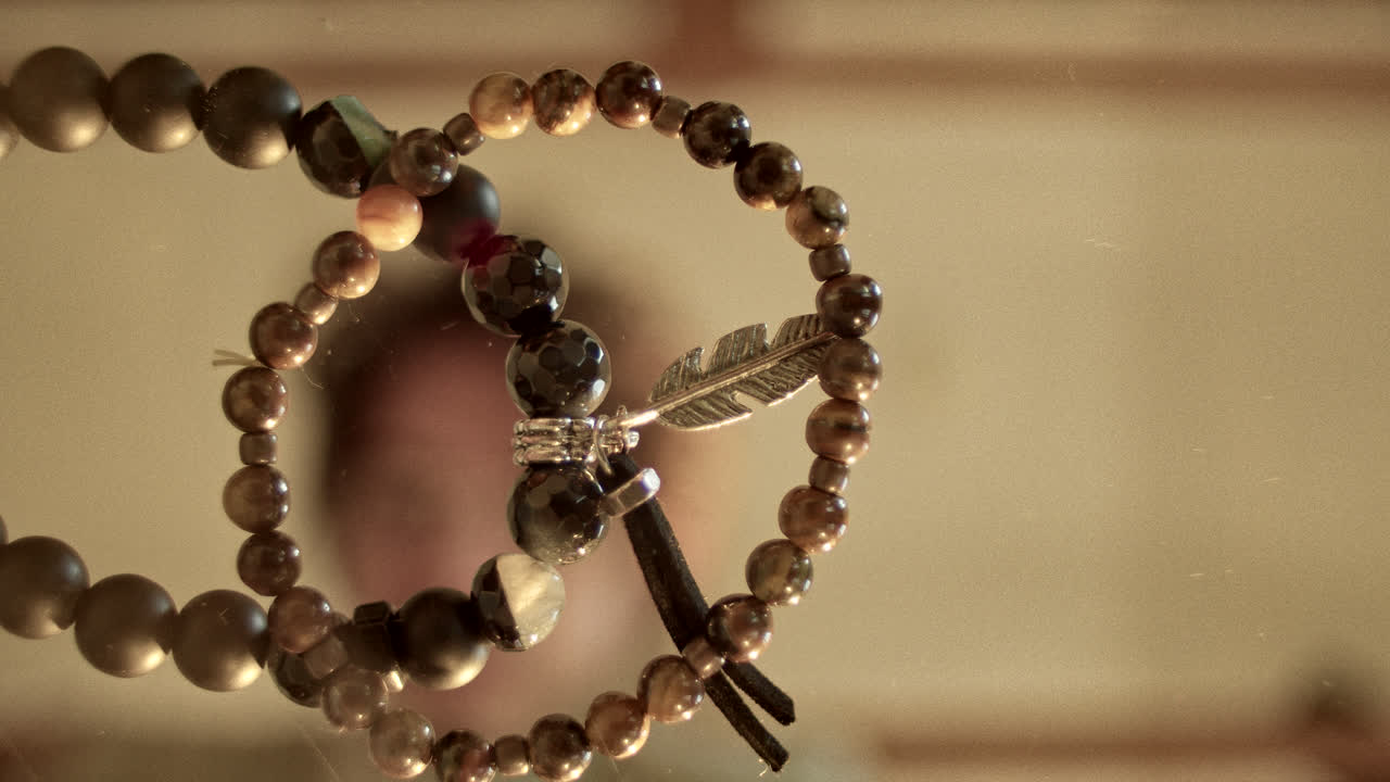 Beaded Bracelets with Feather Charm and Reflections