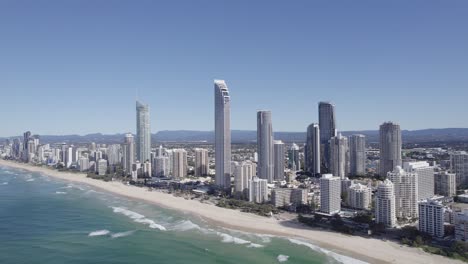 aerial view of beach, high-rise buildings and luxury hotels at surfers paradise, queensland, australia - drone shot