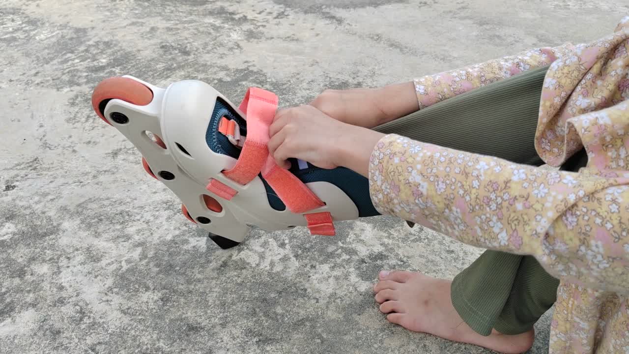Children putting on roller blades with parental supervision. Designed for kids, these roller blades fit well, ensuring comfort and safety during use.