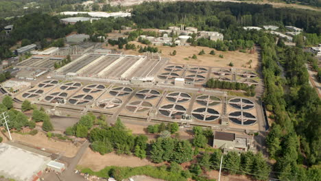pan down aerial shot over american waste water processing plant