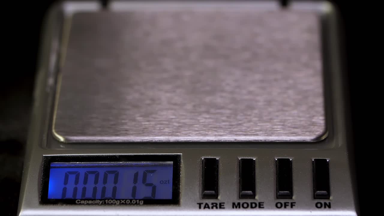 Weighing a Pill on a Digital Scale