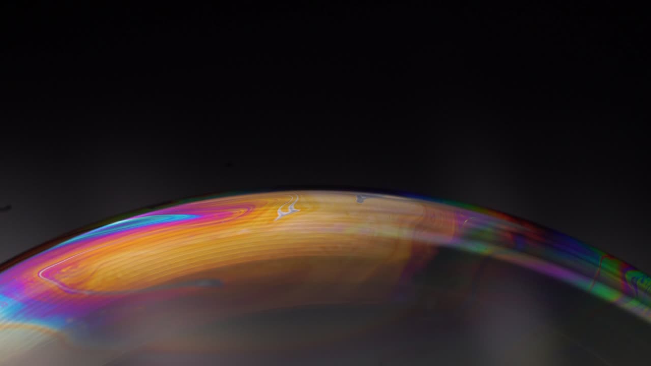 Experience a blend of surreal visuals and celestial inspiration in an experimental soap bubble video, capturing cosmic magic.