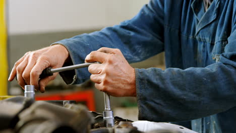 mechanic examining a car 4k