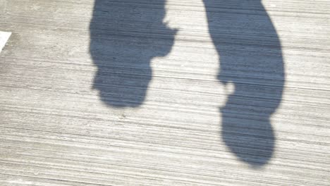 shadows of two people walking