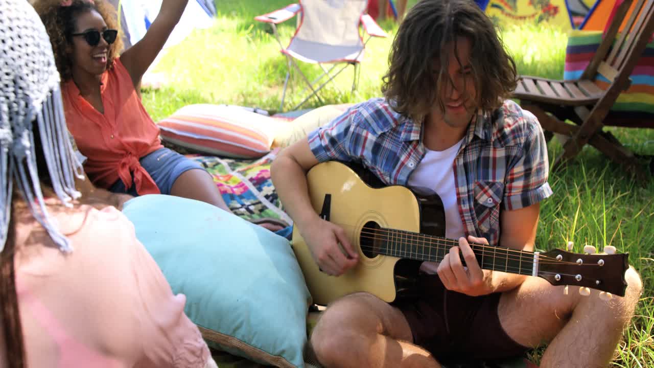 Hipster man playing guitar
