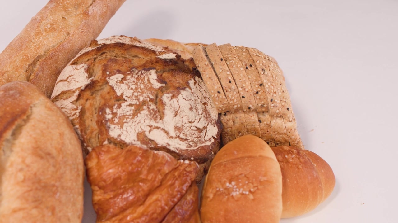 Assortment of Freshly Baked Bread on White Background