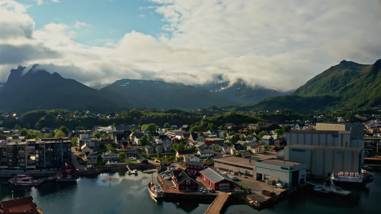 Aerial drone shot over Svolvaer, Lofoten Islands, Norway.
High view of the fishermen town and the scenic nordic landscape.