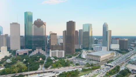 houston texas panoramic cityscape high-rise skyscrapers, highway traffic aerial drone fly downtown center