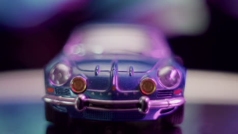 close-up of a blue toy car with bokeh lights