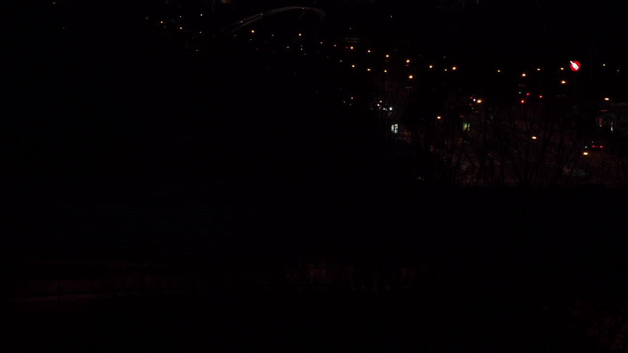 Nighttime Urban Scene with City Lights and Transportation