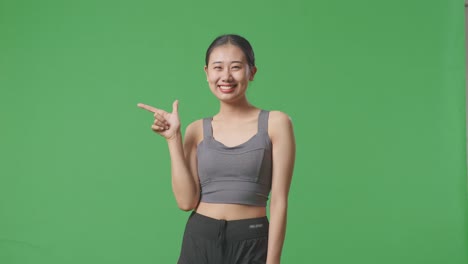 woman in sportswear pointing