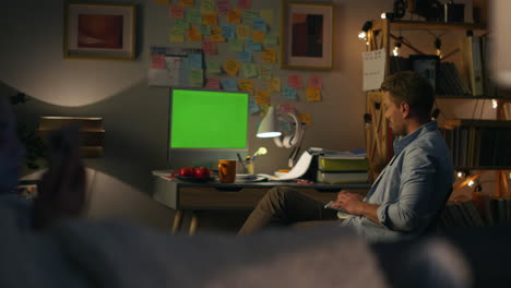 involved freelancer typing chromakey computer. man browsing wireless keyboard