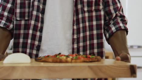 man making pizza at home