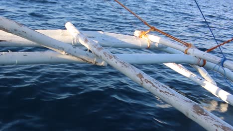 beautiful blue water off a small island in the philippines while riding on an iconic baroto boat