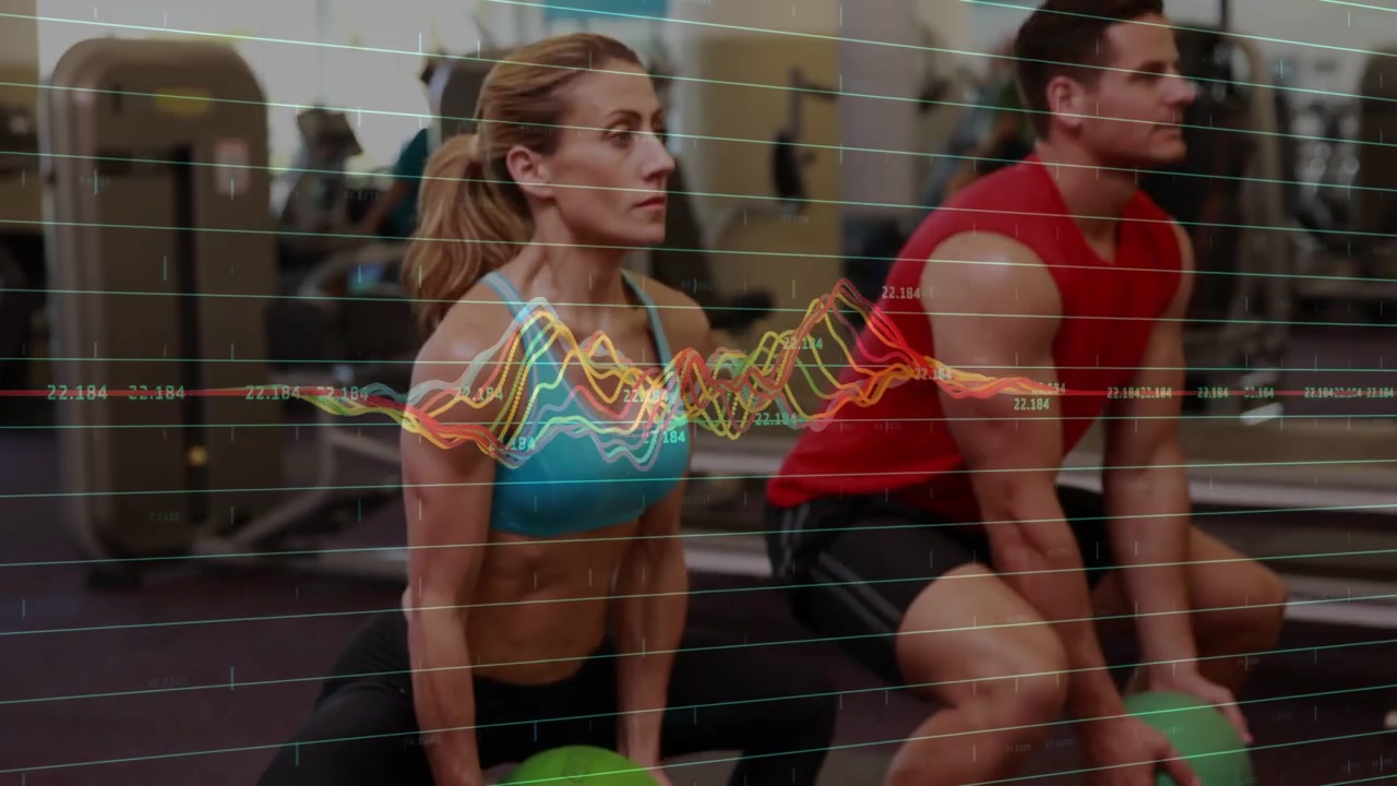 Exercise duo with green balls doing synced squats, camera pulling up causing waveform for fitness