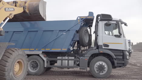 excavator loading dump truck