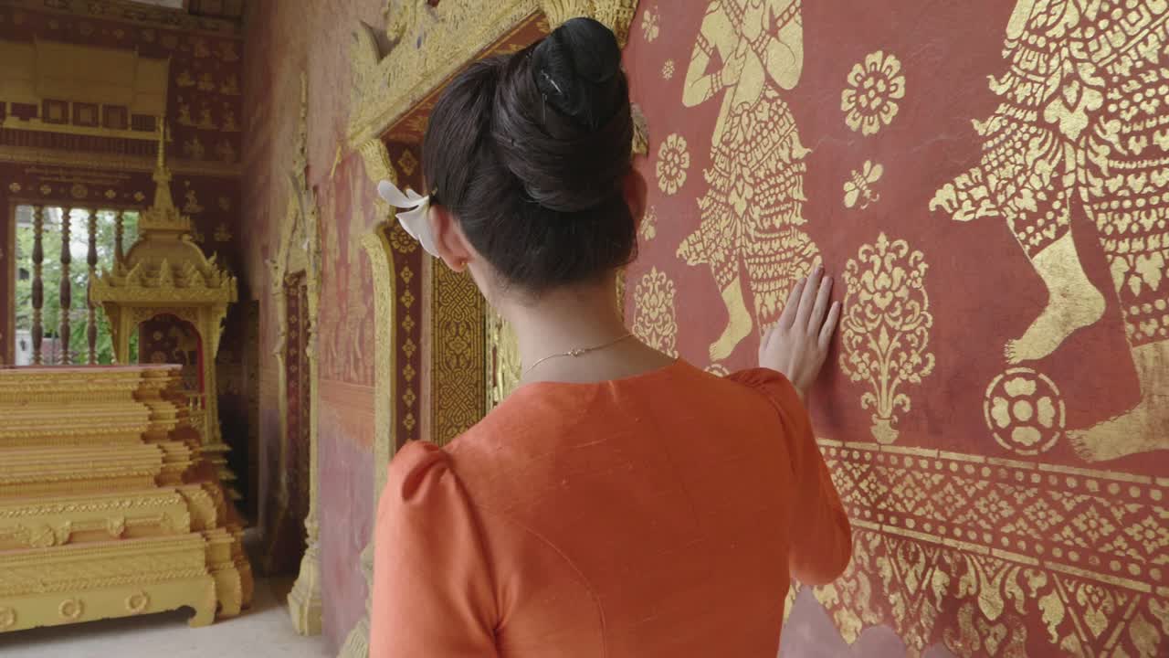 Asian Girl Wearing Traditional Dress Walk And Touching Temple Wall, Slow Motion