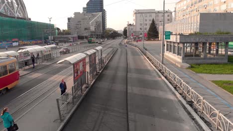 city street under construction with bus stops