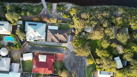 travelling top shot over busselton city neighborhood houses roofs, australia