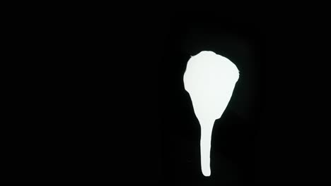 Abstract White Paint Drip on Black Background