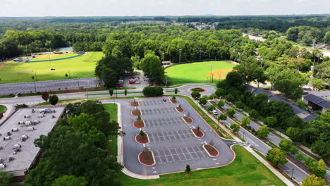 aerial view of empty car park, streets and sport facilities in suburbs